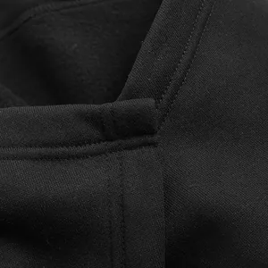 Macro detail view of black men's punk cloak jacket featuring thickened fleece lining texture