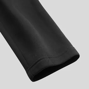 Close-up of black cuff detail on a men's winter thickened cloak jacket