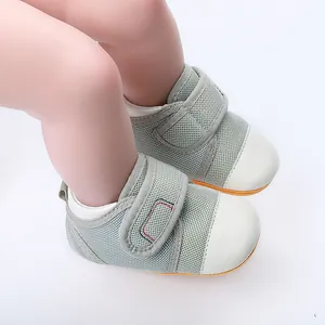 Close-up of breathable green mesh baby walking shoes with non-slip rubber soles