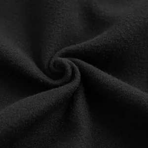 Macro shot of premium black thickened fabric texture for winter men's cape coat.