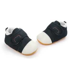 Detail view of navy blue mesh baby walking shoes with anti-slip rubber sole.