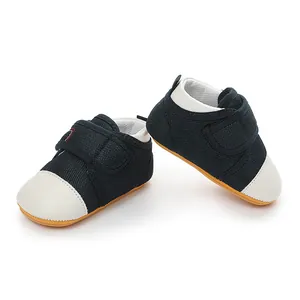 Detail view of breathable navy mesh baby walking shoes with white toes and non-slip soles