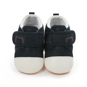 Navy blue mesh baby walking shoes with white non-slip rubber soles and velcro straps