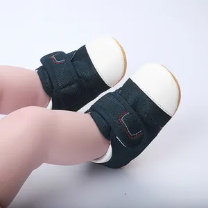Close-up of navy blue mesh baby walker shoes with white toe and velcro strap