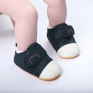 Detail of navy blue mesh baby walker shoes with white toe cap and velcro strap
