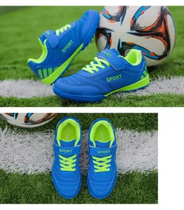 Detail showing the blue breathable mesh upper and neon green lining of soccer shoes.