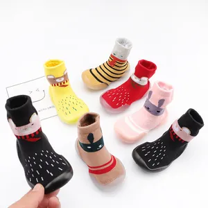 Detail of cute animal pattern baby sock shoes with non-slip rubber soles