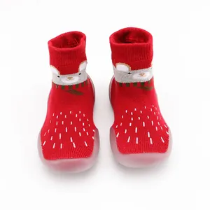 Red infant sock shoes with thick knit cartoon bear design and non-slip soft rubber soles