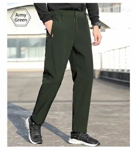 Full-length detail of men's army green nylon outdoor sports trousers shown on model