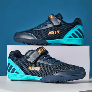 Breathable mesh kids' turf soccer shoes with velcro strap in navy and teal