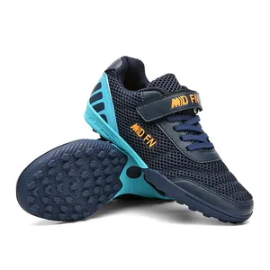 Breathable mesh children's soccer shoes with turf cleats and velcro strap.