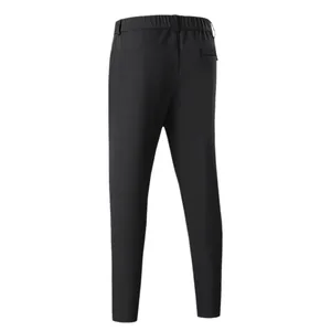 Back view of men's black nylon casual sports pants with elastic waist and zip pocket