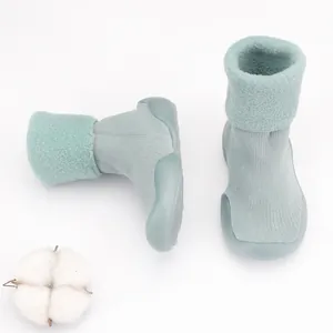 Detailed view of mint green baby fleece-lined sock shoes with soft non-slip sole