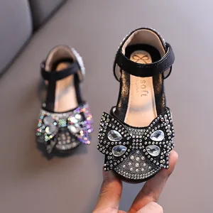 Sparkling black rhinestone princess shoes for girls with large bow detail