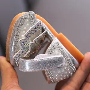 Sparkling silver rhinestone princess shoes for girls with elegant pearl accents.