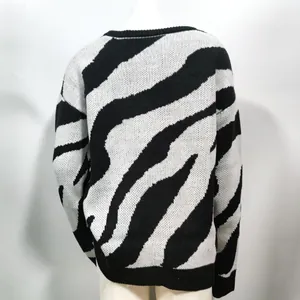 Back view detail showing texture of women's knitted zebra pattern crewneck sweater