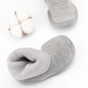 Grey knit baby snow sock shoes with warm fleece lining and non-slip soft rubber soles