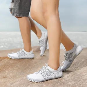 Breathable white and gray water shoes for beach hiking and swimming on rocky shores.