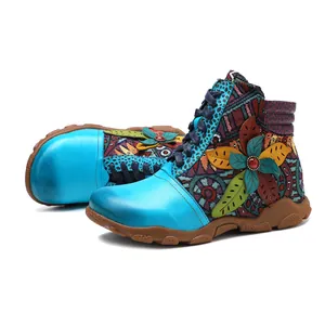 Detailed view of colorful vintage women's ankle boots with floral appliqué patterns
