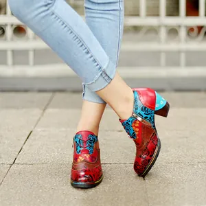 Detailed view of women's retro ethnic high heels with colorful floral prints