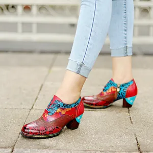 Detailed side view of vintage ethnic floral patchwork leather high heels with block heel