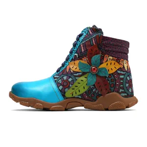 Detailed side view of retro women's ankle boots featuring vibrant floral embroidery