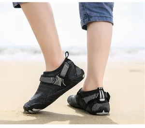 Close-up of quick-drying five-finger wading shoes for children on a sunny sandy beach
