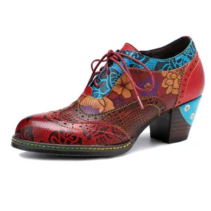 Detailed side view of vintage ethnic floral print leather high heels for elegant women.