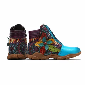 Detailed view of bohemian style retro ankle boots with colorful floral patchwork