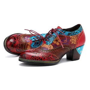 Vintage ethnic patchwork high heels with vibrant floral prints and lace-up detail.