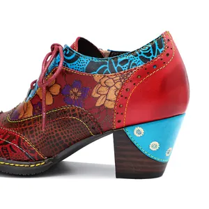Close-up detail of ethnic floral patchwork high heel shoes with intricate stitching
