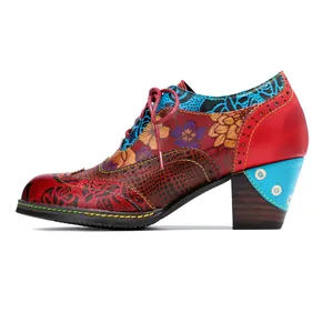 Macro side view of vintage patchwork high heels featuring colorful floral print textures.