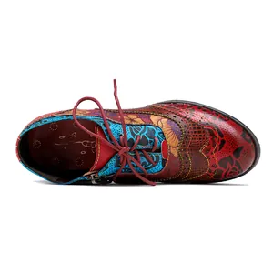 Top view detail of vintage ethnic printed women's shoes with colorful floral patterns