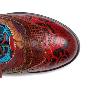 Close-up detail of retro ethnic patchwork leather shoe with vibrant floral patterns