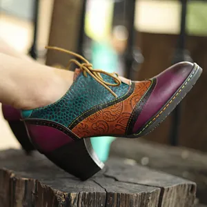 Side view of colorful leather patchwork brogue chunky heels with floral patterns