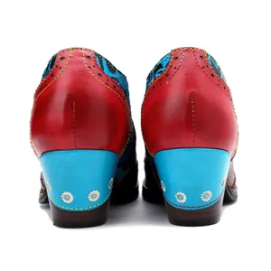 Rear view of vintage floral patchwork high heels with red and blue leather detail.