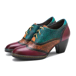 Detail of vintage patchwork leather brogue high heels with colorful floral and leopard prints