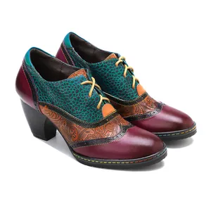 Detail of vintage patchwork genuine leather Brogue shoes with chunky high heels
