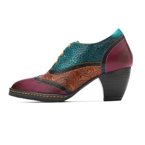 Side view of multi-colored patchwork genuine leather brogue chunky high heels