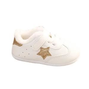 White baby winter walker shoes with gold glitter star and plush lining
