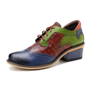 Detailed side view of vintage color-block Brogue shoe with floral embossed leather