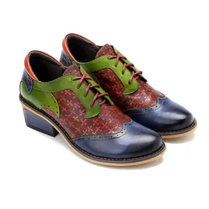 Detail of retro ethnic style Brogue shoes with colorful leather patchwork and floral patterns.