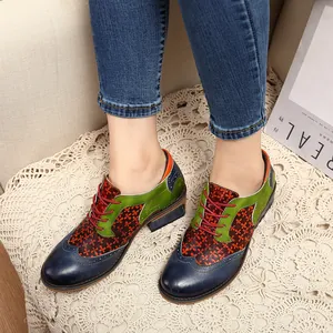 Close-up of vintage ethnic patchwork Brogue shoes with unique floral pattern detail.