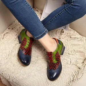 Detail showing colorful patchwork leather and red laces of a vintage Brogue shoe