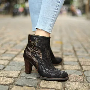 Detail of French vintage lace ankle boots with chunky wood-grain heels on street
