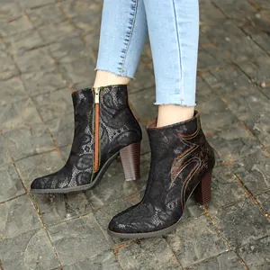 Detailed view of French vintage lace ankle boots with thick wooden heels