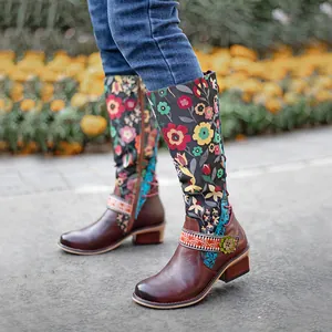Detail view of vintage floral ethnic knee-high boots with adjustable straps