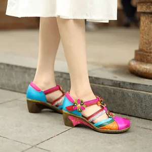 Side detail of vibrant retro floral Mary Jane wedge sandals with colorful leather patches