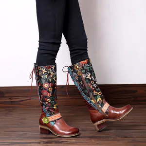 Retro ethnic style knee-high leather boots with floral pattern and lacing detail
