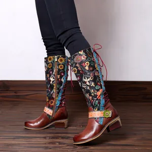 Detailed view of retro ethnic floral knee-high boots with adjustable laces and side zipper